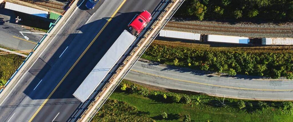 Overhead view of a truck driving on an overpass