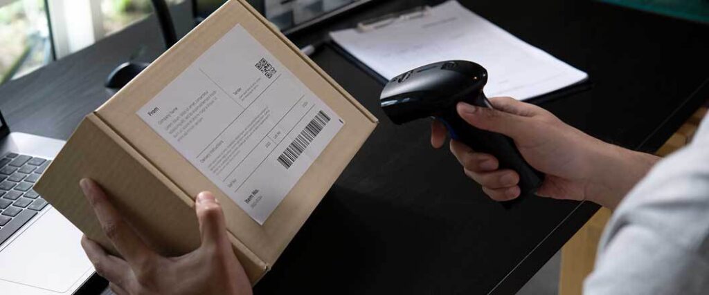 A parcel is scanned for shipment